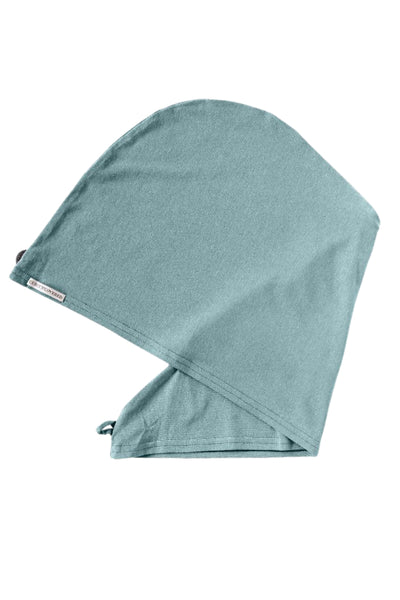 Bambus Turban Handtuch mit Kokosnussknopf in mint grün von CURLY N COVERED, einmal gefaltet auf weißem Hintergrund
